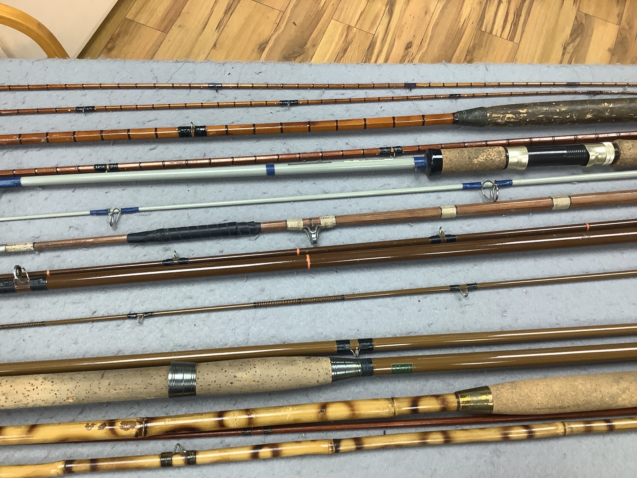 A quantity of fishing rods in fabric sleeves (6)